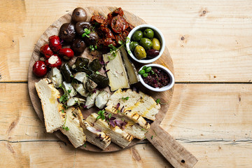 meat and cheese charcuterie on wooden platter