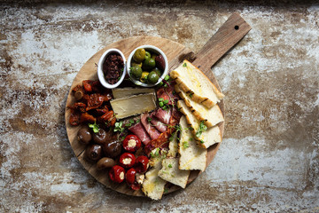 Selection of hors d'oeuvres on cutting board