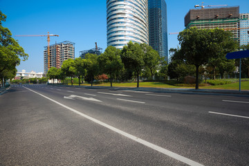 Empty road surface floor with buildings background