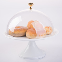 donuts or delicious donuts in tray on background.