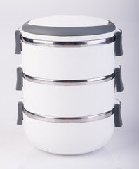 Food Container Tiffin or food carrier on background.