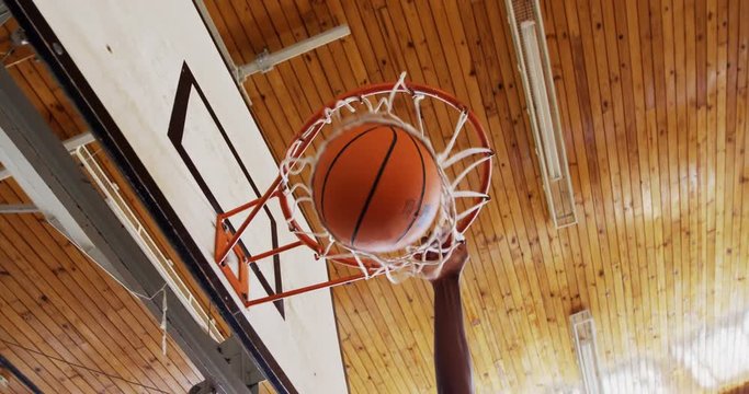 Basketball payer playing in the court