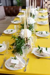 Candles and goblets on a decorated wedding table. selective focus