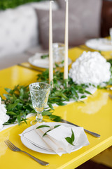 Candles and goblets on a decorated wedding table. selective focus