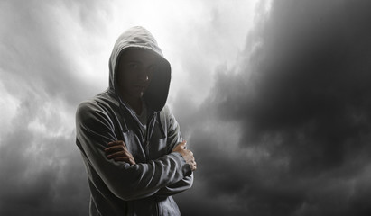 Silhouette of man in hoody