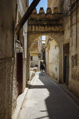 A narrow street at the Medina of Fez, Morocco