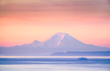 A ferry crossing the Puget Sound at sunrise with Mount Rainier in the background, Washington, USA - obrazy, fototapety, plakaty