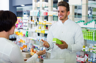 pharmacist helping customers