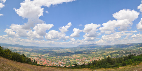 Panorama of the city under a mountain  with a beautiful dynamic sky. Serbian spa city Sokobanja under a Rtanj mountain