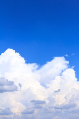 Naklejka na ściany i meble Blue sky background with white clouds on sunny summer or spring day.