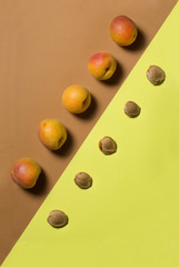 Abstract still life with apricots and apricot bones