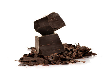 Pieces of dark chocolate on a white background