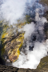 Active Bromo volcano mountain hole with sulfur gas and smoke