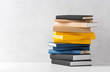  pile of paperback books on a table