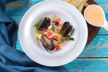 Tasty seafood on plate on table close-up