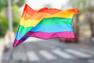 Blurred view of quiet street with road and high buildings