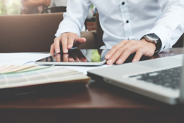 Graphic design and color swatches and pens on a desk. Architectural drawing with work tools and accessories.
