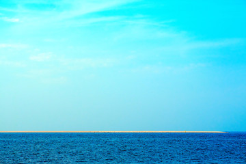 Fototapeta premium Blue blue sea with sandstrips