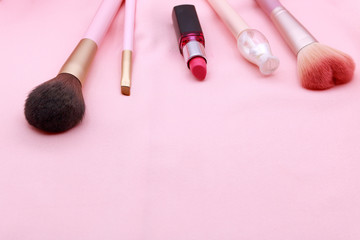 Obraz na płótnie Canvas Make up products on pink background.