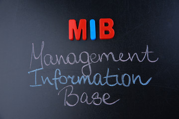 Phrase MANAGEMENT INFORMATION BASE written on blackboard. Management concept © Africa Studio