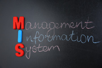 Phrase MANAGEMENT INFORMATION SYSTEM written on blackboard. Management concept