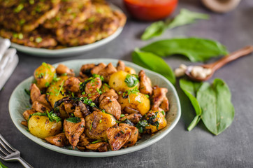 Potato pancakes, fried chicken with potatoes