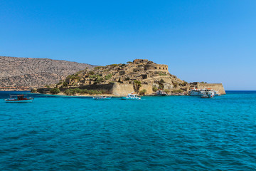Fototapeta na wymiar Ancient Ruins Of With Medieval Fortress Spinalonga Island Near Crete In Greece. The last leprosorium.