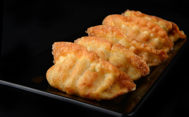 Deep fried gyoza crispy and golden colour.