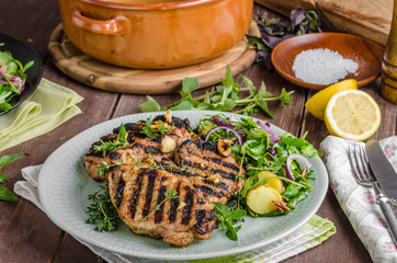 Grilled pork chops with lettuce salad