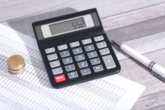Calculator on financial documents, accounting concept