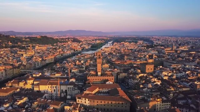 florence aerial view at sunrise flying over city center