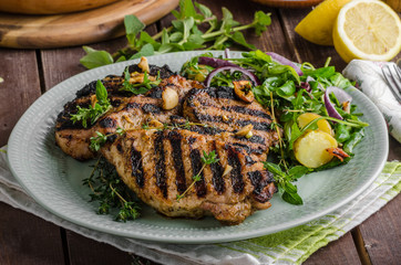 Grilled pork chops with lettuce salad