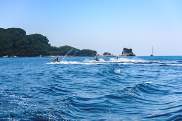 Naklejka premium Rest on the sea. A man on a water motorcycle