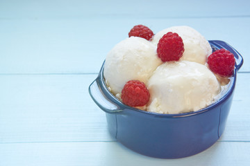 three balls of ice cream in ceramic bowl
