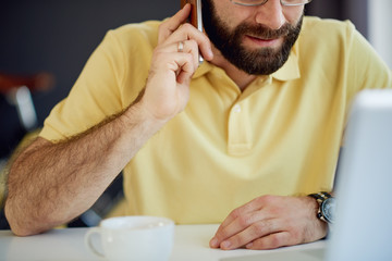 Caucasian freelancer using tablet device  in modern home office