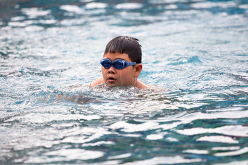 children swimming, Obese children are swimming.