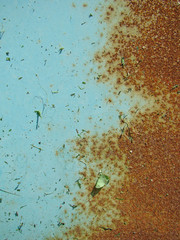 Blue paint on a rusty wall