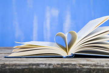 Open book on a wooden table