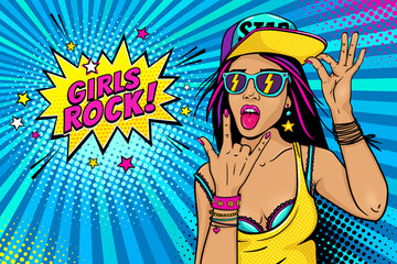 Sexy young girl in baseball cap, glasses with flash, hand with rock n roll sign and open mouth with tongue and Girls Rock speech bubble. Vector bright illustration in retro comic pop art style. - 165058313