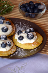 Fresh homemade pancakes with blueberries and cottage cheese.