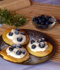 Fresh homemade pancakes with blueberries and cottage cheese.