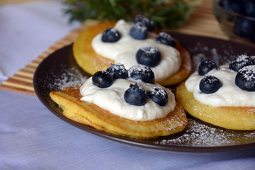 Fresh homemade pancakes with blueberries and cottage cheese.