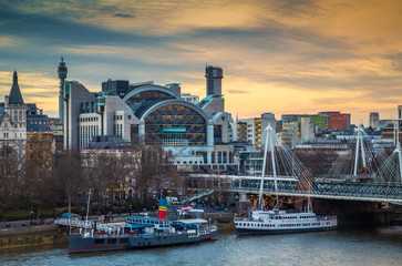 London, England - Beautiful sky and clouds at Charing Cross station and Golden Jubilee Bridge at Embankment before sunset