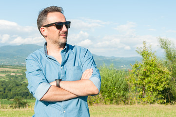 Happy handsome man standing outdoors