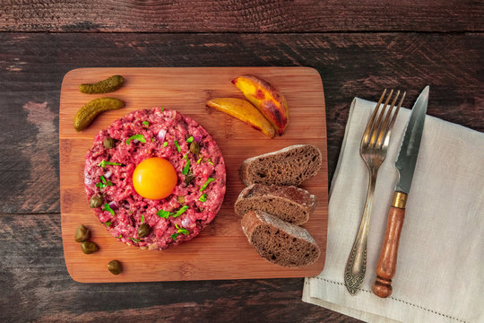 Steak tartare with garnish and place for text