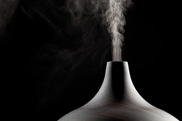 Close up of an ultrasonic aromatherapy oil diffuser in use. - obrazy, fototapety, plakaty