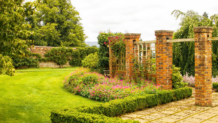 Brick pillars within a walled garden