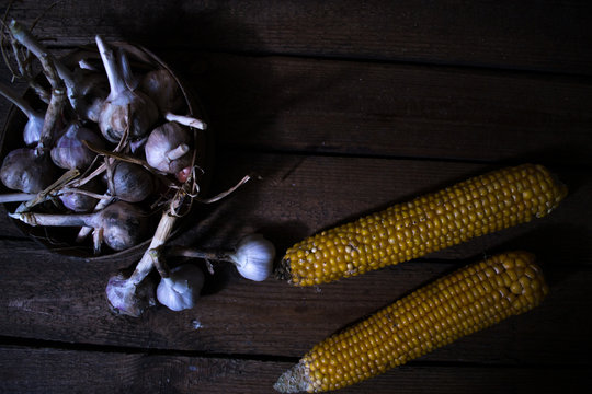 Still life of harvest of garlic and cabbage of corn.