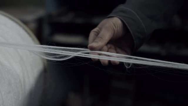 The worker checking quality of fiber
