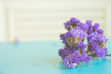 Purple flowers on blue background with copy space.vintage tone